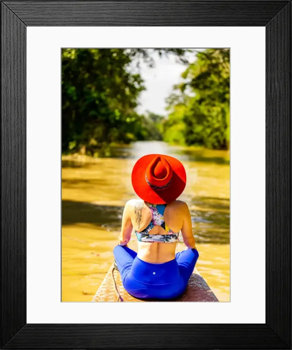 Framed Print : Woman searching for wildlife on the Amazon River, Peru, South America Framed Print : Woman searching for wildlife on the Amazon River, Peru, South America