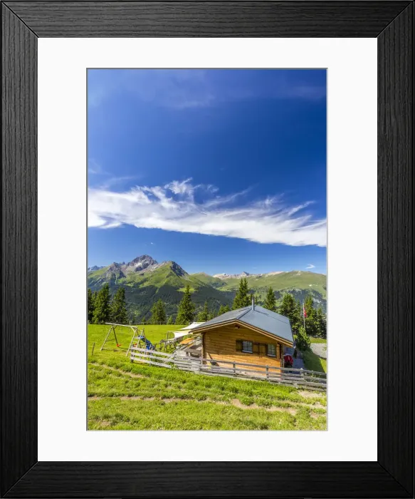 Framed Print : Alpine hut with Swiss flag, beneath stunning clouds. Surses, Surselva, Graubunden Framed Print : Alpine hut with Swiss flag, beneath stunning clouds. Surses, Surselva, Graubunden
