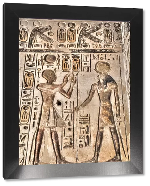 Relief, Pharaoh on left, God Horus on the right, Temple of Khonsu, Karnak Temple Complex