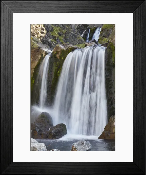 Framed Print : A waterfall cascades down a gorge cut into coastal cliffs, at Spekes Mill Mouth Framed Print : A waterfall cascades down a gorge cut into coastal cliffs, at Spekes Mill Mouth