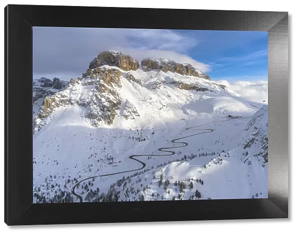 Winding road in the snow, aerial view, Pordoi Pass, Dolomites, Trentino-Alto Adige, Italy
