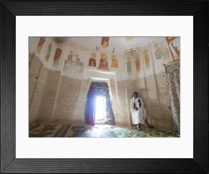 Framed Print : Orthodox Christian priest holding the prayer book inside Daniel Korkor church Framed Print : Orthodox Christian priest holding the prayer book inside Daniel Korkor church