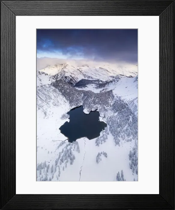Framed Print : Lake Cavloc surrounded by snow, aerial view, Bregaglia Valley, Engadine Framed Print : Lake Cavloc surrounded by snow, aerial view, Bregaglia Valley, Engadine
