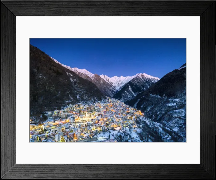 Framed Print : View by drone of winter dusk over the illuminated village of Premana, Valsassina Framed Print : View by drone of winter dusk over the illuminated village of Premana, Valsassina