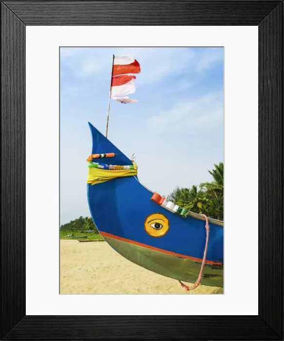 Framed Print : Colourful fishing boat with Indian flag and golden eye motifs on Marari Beach Framed Print : Colourful fishing boat with Indian flag and golden eye motifs on Marari Beach