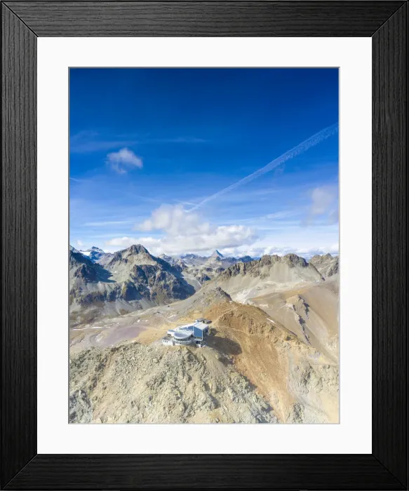 Framed Print : Aerial by drone of clear sky over Piz Nair and cable car station on top, Engadine