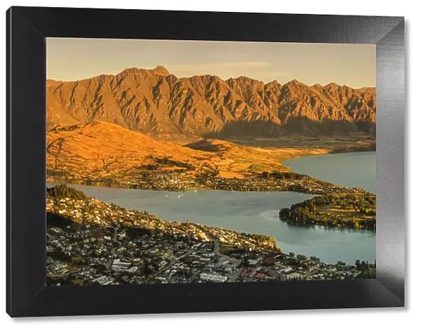 View over Queenstown and Lake Wakatipu to The Remarkables Mountains at sunset, Otago