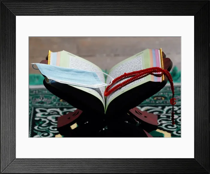 Framed Print : Coronavirus (COVID-19) epidemic, an open Holy Quran, Muslim prayer beads and a mask Framed Print : Coronavirus (COVID-19) epidemic, an open Holy Quran, Muslim prayer beads and a mask