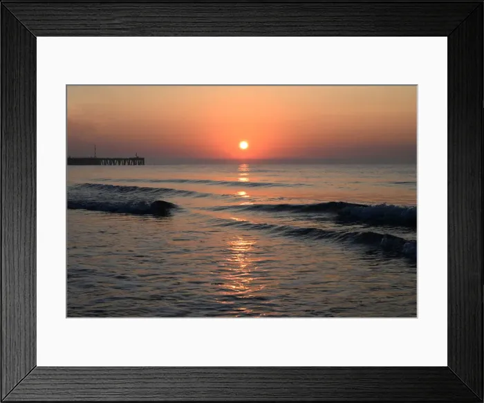 Framed Print : Sunrise over calm sea silhouetting the old derelict harbour wall and groyne, Walberswick Framed Print : Sunrise over calm sea silhouetting the old derelict harbour wall and groyne, Walberswick