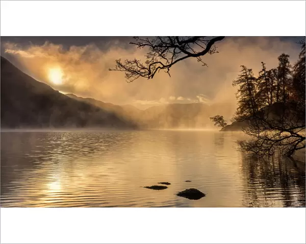 Dawn light and clearing mist over Glenridding and Ullswater, Lake District National Park
