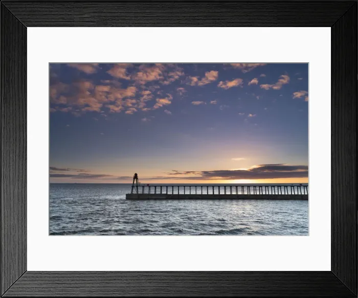 Framed Print : Sunrise over the North Sea and Whitby harbour and piers in late summer, Whitby Framed Print : Sunrise over the North Sea and Whitby harbour and piers in late summer, Whitby