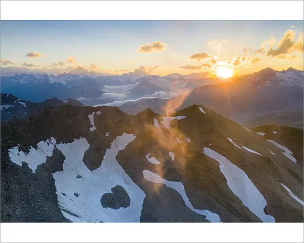 Last rays of sunset light the rocky mountain peaks, Furka Pass, Canton Uri, Switzerland