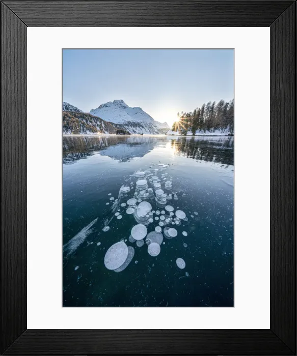 Framed Print : Ice bubbles trapped in frozen Lake Sils at sunset with Piz Da La Margna in background Framed Print : Ice bubbles trapped in frozen Lake Sils at sunset with Piz Da La Margna in background
