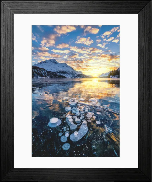 Framed Print : Clouds in the burning sky at sunset on Piz Da La Margna