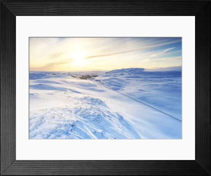 Framed Print : Aerial view of empty road across mountains covered with snow lit by sunrise, Sennalandet Framed Print : Aerial view of empty road across mountains covered with snow lit by sunrise, Sennalandet