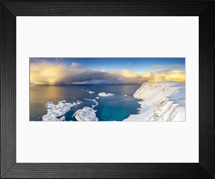 Framed Print : Burning sky at sunrise over the cold sea and Sorvaer village covered with snow Framed Print : Burning sky at sunrise over the cold sea and Sorvaer village covered with snow