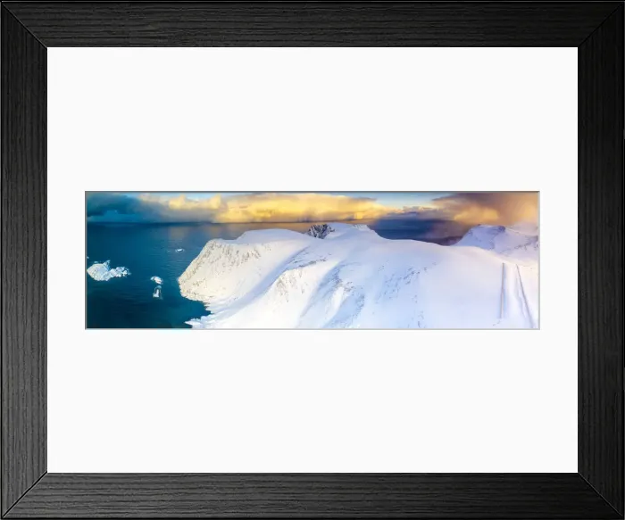 Framed Print : Aerial view of sunrise on snow capped mountains and blue arctic sea, Sorvaer Framed Print : Aerial view of sunrise on snow capped mountains and blue arctic sea, Sorvaer