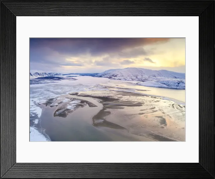 Framed Print : Aerial view of cold sea framed by snow capped mountains at sunset Framed Print : Aerial view of cold sea framed by snow capped mountains at sunset