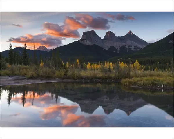 Sunrise in autumn at Three Sisters Peaks near Banff National Park, Canmore, Alberta