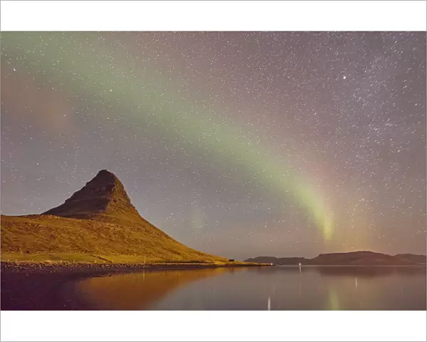 The Aurora Borealis (Northern Lights) seen in the night sky above Grundarfjordur