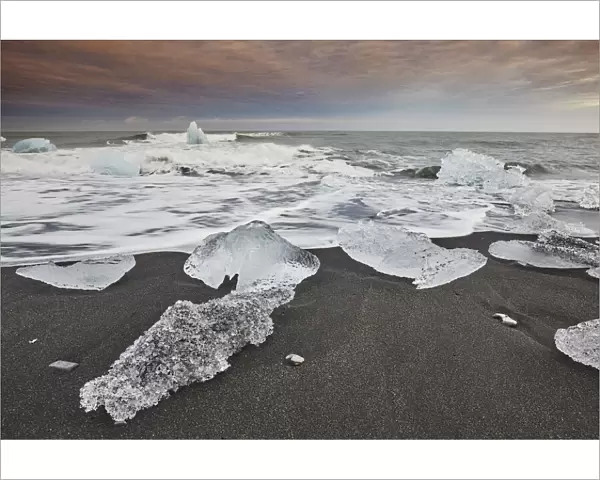 Melting glacial ice, carved from the Vatnajokull icecap, on the beach at Jokulsarlon