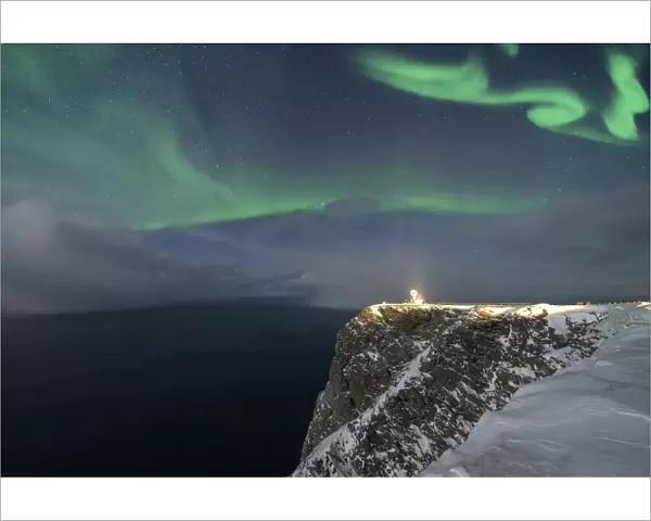 Northern Lights (Aurora Borealis) over North Cape cliff in winter, Mageroya island