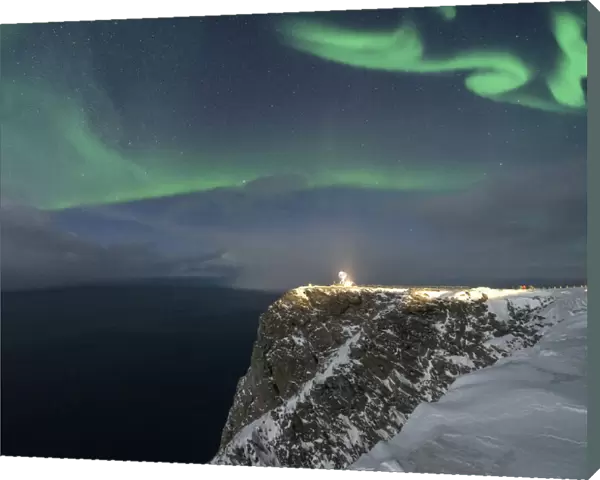 Northern Lights (Aurora Borealis) over North Cape cliff in winter, Mageroya island