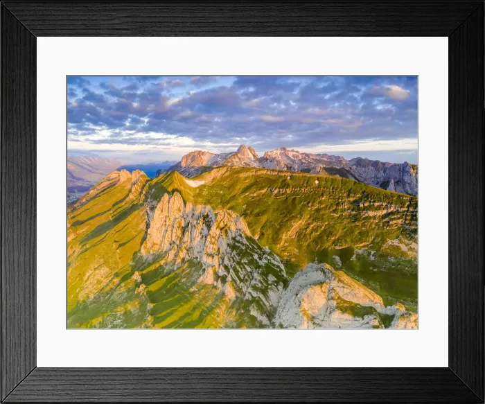 Framed Print : Clouds at dawn over the majestic Santis and Saxer Lucke mountains, aerial view Framed Print : Clouds at dawn over the majestic Santis and Saxer Lucke mountains, aerial view