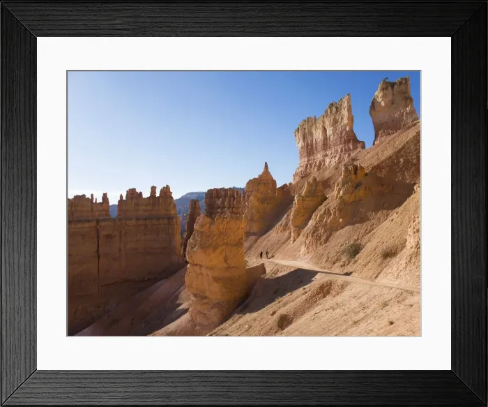 Framed Print : Two hikers heading down the Navajo Loop Trail below Sunset Point Framed Print : Two hikers heading down the Navajo Loop Trail below Sunset Point