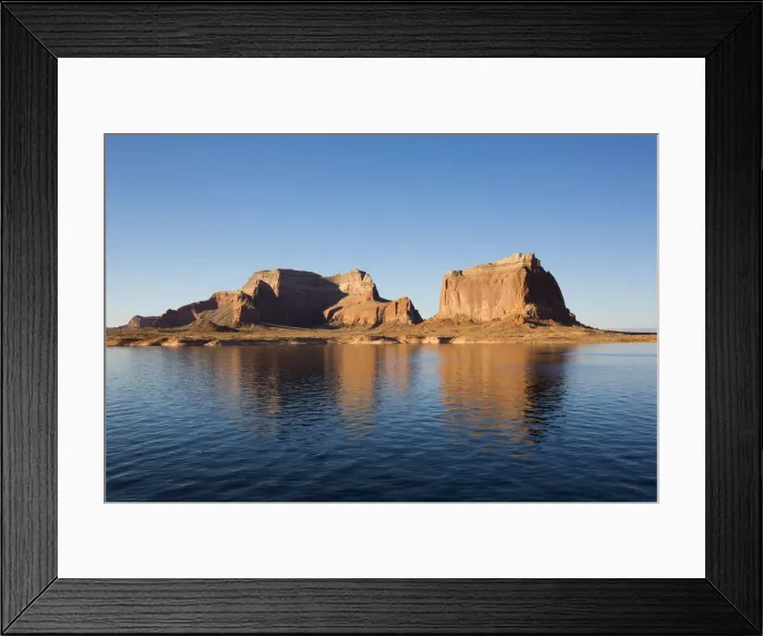 Framed Print : Sandstone cliffs reflected in the tranquil waters of Lake Powell