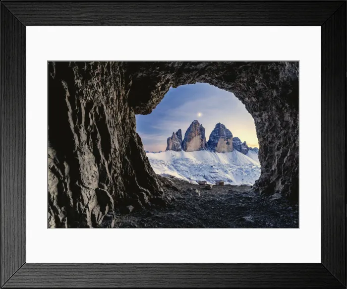 Framed Print : Tre Cime di Lavaredo lit by moon seen from opening in rocks of a war cave Framed Print : Tre Cime di Lavaredo lit by moon seen from opening in rocks of a war cave