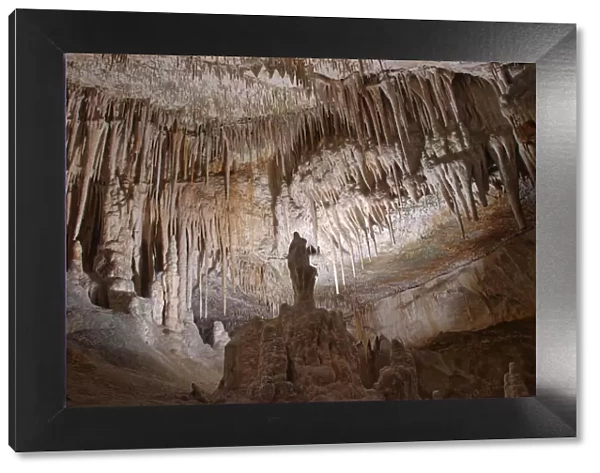 Limestone cave interior with many stalactites and stalagmites