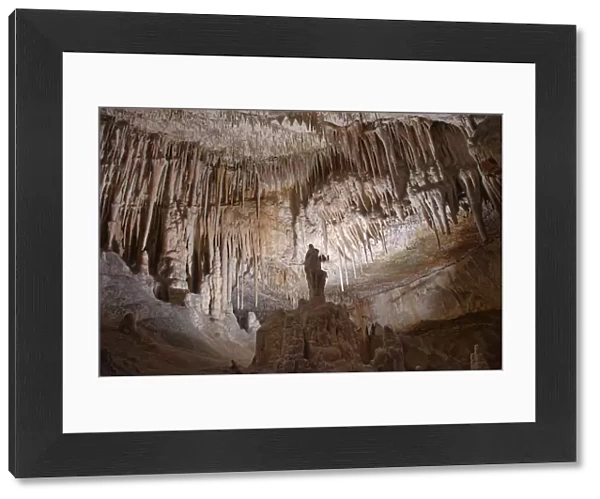 Limestone cave interior with many stalactites and stalagmites