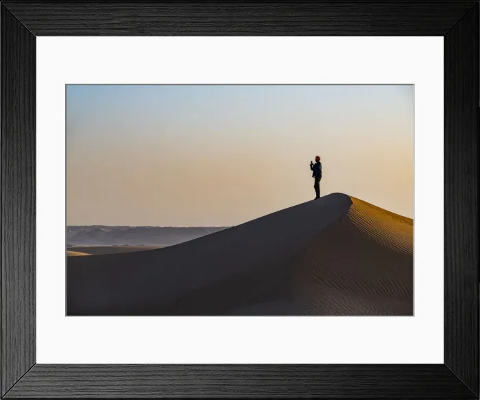 Framed Print : Man hiking through the sand dunes, Dirkou, Djado Plateau, Sahara, Niger, Africa Framed Print : Man hiking through the sand dunes, Dirkou, Djado Plateau, Sahara, Niger, Africa