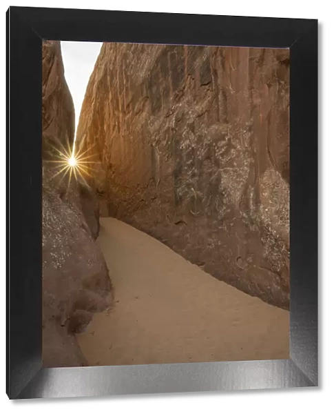 Sunburst over a sandy dune, Arches National Park, Utah, United States of America