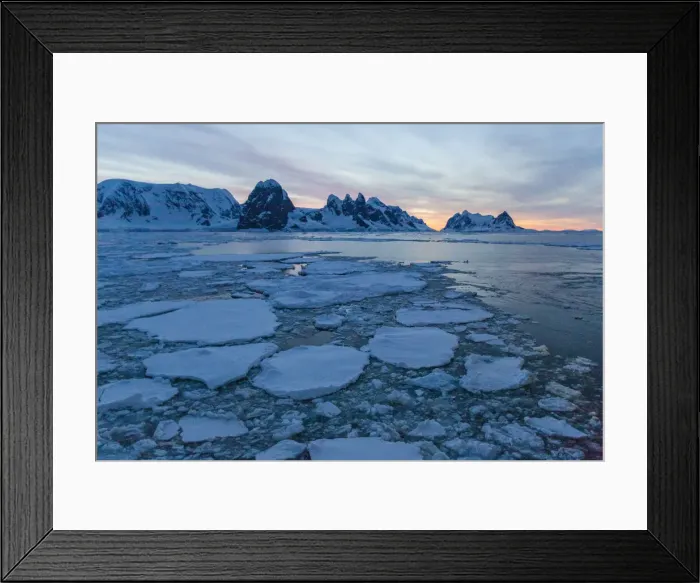 Framed Print : Sunrise on snow-covered mountains and dense sea ice in Neumayer Channel Framed Print : Sunrise on snow-covered mountains and dense sea ice in Neumayer Channel