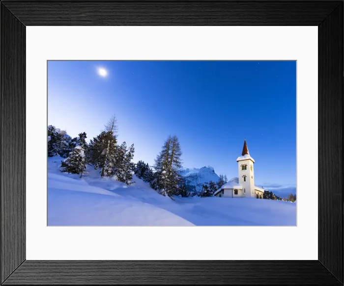 Framed Print : Dusk over Chiesa Bianca in the snowy landscape lit by moon, Maloja, Bregaglia Valley