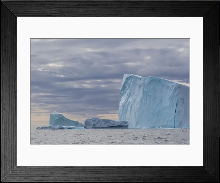Framed Print : Huge icebergs at Cape Brewster, the easternmost point of the jagged Framed Print : Huge icebergs at Cape Brewster, the easternmost point of the jagged