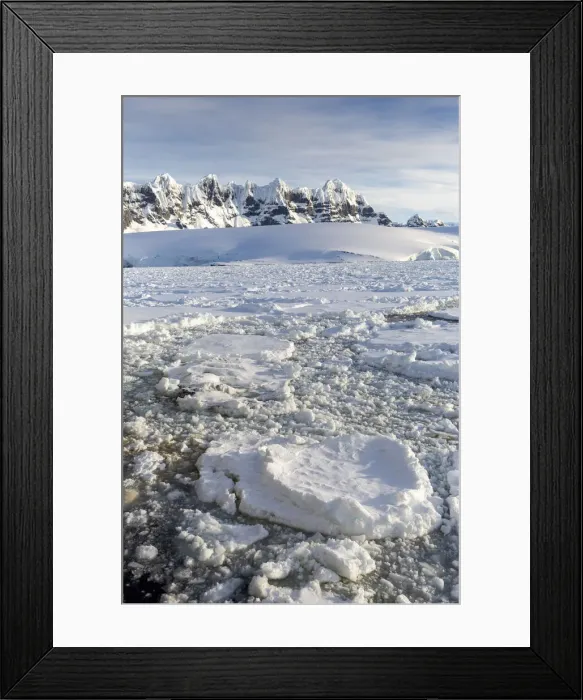 Framed Print : Snow-covered mountains and dense sea ice in Neumayer Channel, Palmer Archipelago Framed Print : Snow-covered mountains and dense sea ice in Neumayer Channel, Palmer Archipelago
