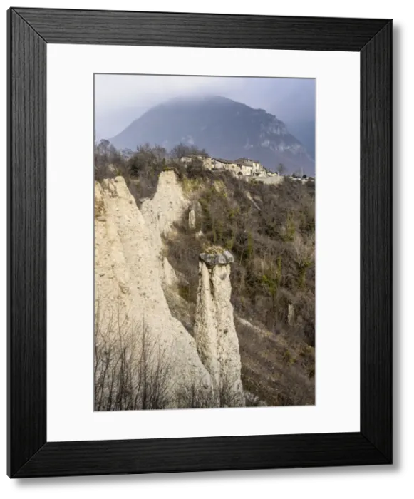 Framed Print : Earth pyramids (rock chimneys) with old houses of Zone, Brescia province, Lombardy, Italy Framed Print : Earth pyramids (rock chimneys) with old houses of Zone, Brescia province, Lombardy, Italy