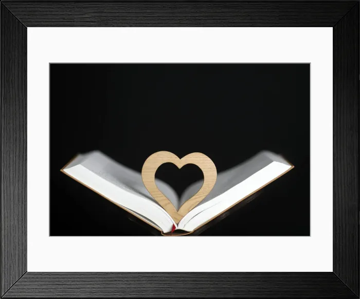 Framed Print : Wooden heart sculpture with a Bible, France, Europe Framed Print : Wooden heart sculpture with a Bible, France, Europe