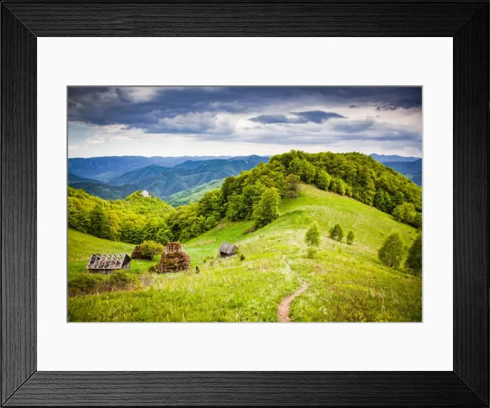 Framed Print : Rural landscape with traditional thatched roof wooden cottages in Dumesti Framed Print : Rural landscape with traditional thatched roof wooden cottages in Dumesti