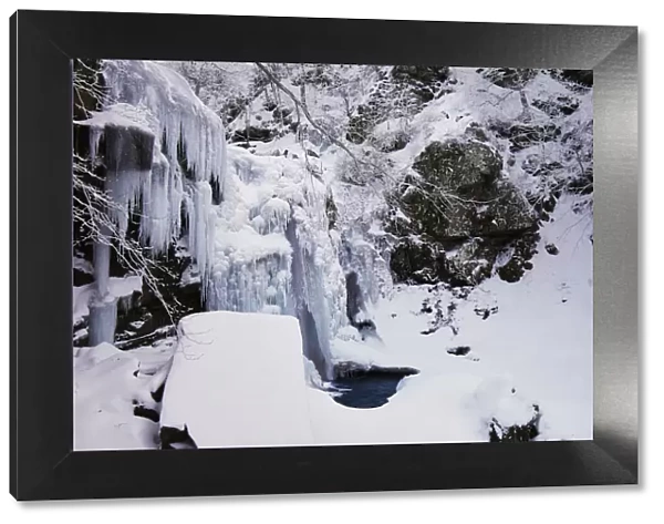 Frozen Dardagna waterfalls in winter with snow, Parco Regionale del Corno alle Scale