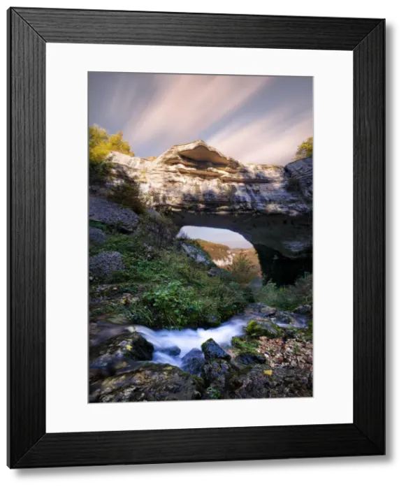 Framed Print : Waterfall flowing below Veja bridge, a huge natural arch in Lessinia, Veneto, Italy Framed Print : Waterfall flowing below Veja bridge, a huge natural arch in Lessinia, Veneto, Italy