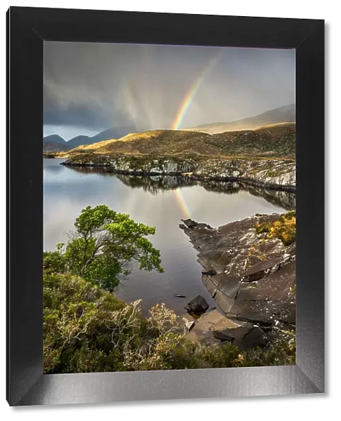 Rainbow and rain clouds over Upper Lake, Killarney National Park, County Kerry, Munster