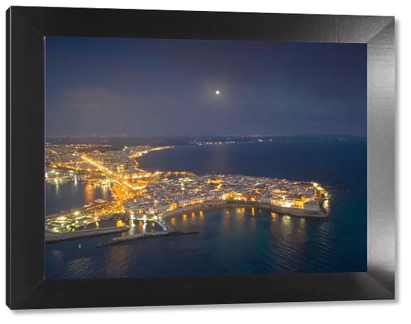 Aerial view of the coastal town of Gallipoli illuminated at night, Lecce province