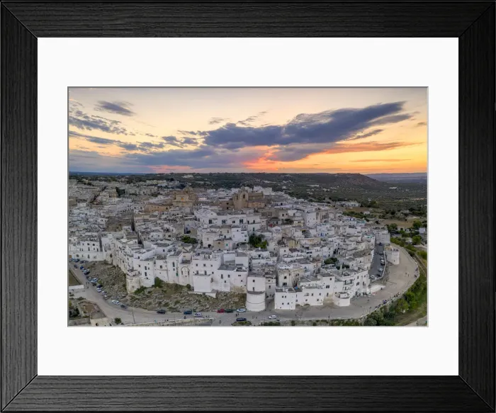 Framed Print : Aerial panoramic of white buildings in the old town of Ostuni at sunset Framed Print : Aerial panoramic of white buildings in the old town of Ostuni at sunset