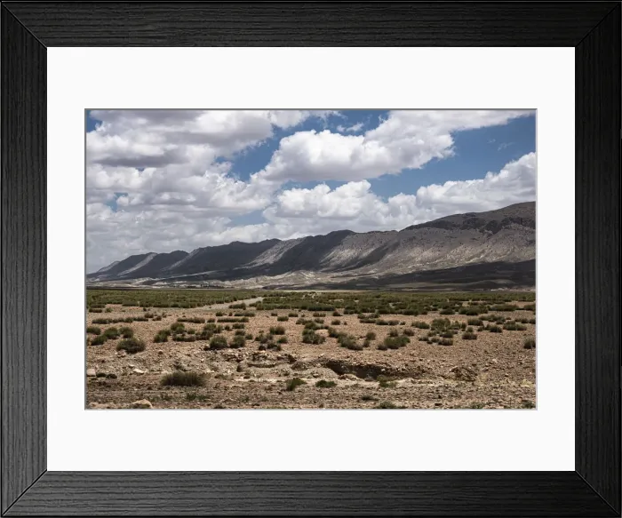 Framed Print : Landscape of Morocco with mountains in the background with white clouds in the sky Framed Print : Landscape of Morocco with mountains in the background with white clouds in the sky