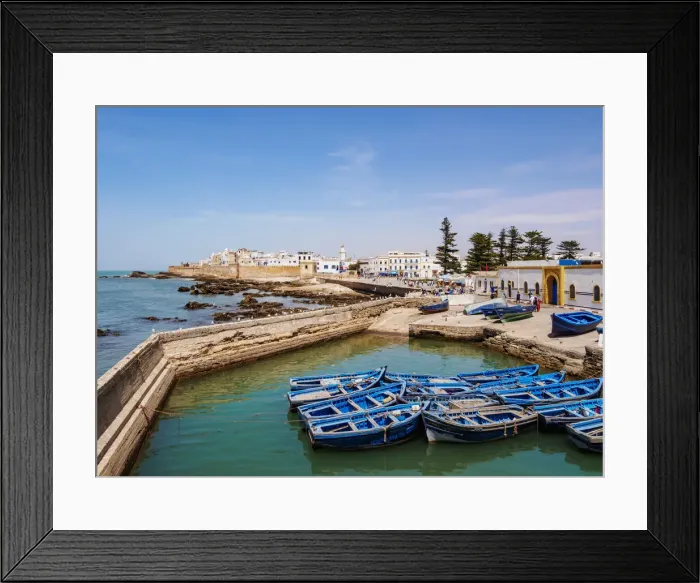 Framed Print : Cityscape with blue boats in the Scala Harbour and the Medina city walls, Essaouira Framed Print : Cityscape with blue boats in the Scala Harbour and the Medina city walls, Essaouira