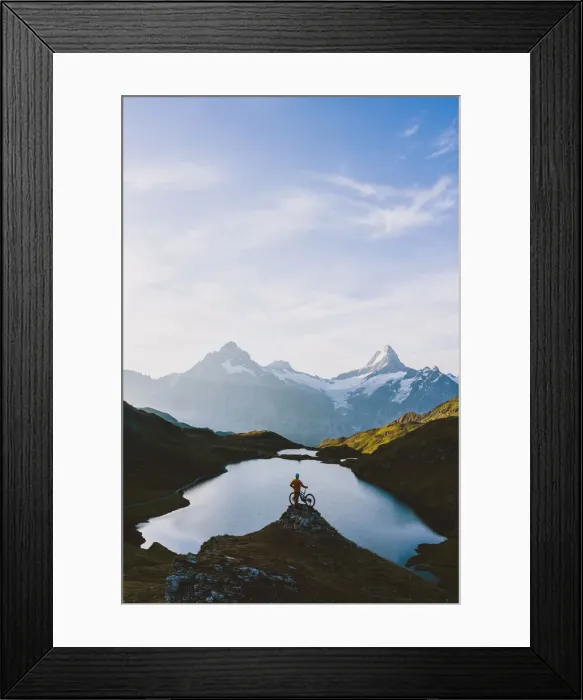 Framed Print : Mountain biker looking at Bachalpsee lake and Bernese Oberland mountains at dawn Framed Print : Mountain biker looking at Bachalpsee lake and Bernese Oberland mountains at dawn